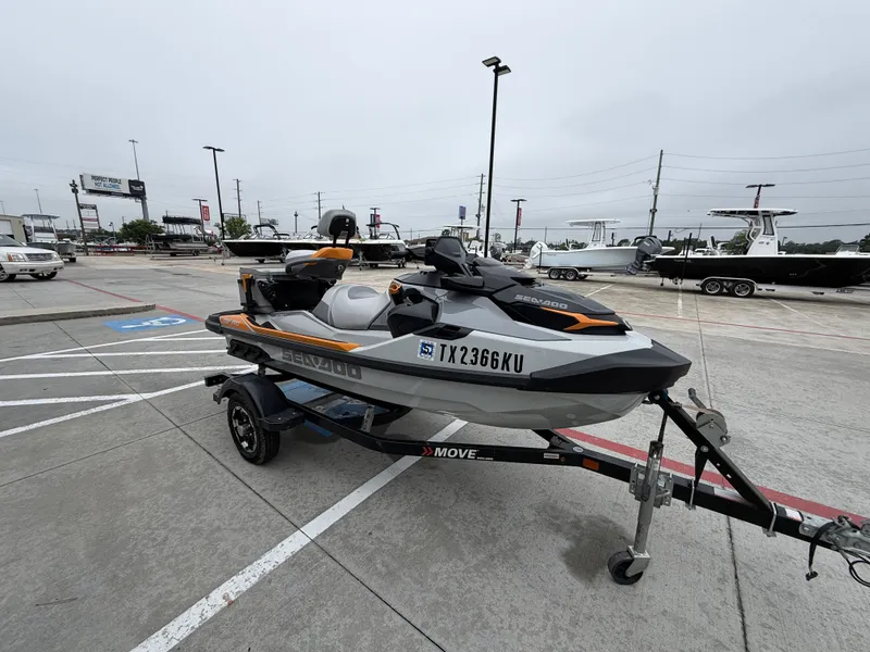 Slide: The Image of A 2022 Sea-Doo FISH PRO TROPHY 170 on a trailer in a parking lot. - 7