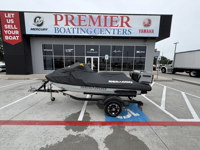 The Image of A 2022 Sea-Doo FISH PRO TROPHY 170 on a trailer outside a boating center. - 1