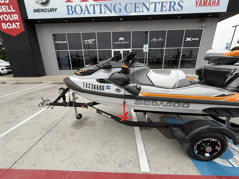 Slide: The Image of A 2022 Sea-Doo FISH PRO TROPHY 170 on a trailer in front of a boating center. - 3