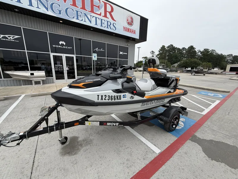 Slide: The Image of A 2022 Sea-Doo FISH PRO TROPHY 170 on a trailer outside a boating center. - 5