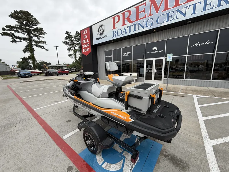 Slide: The Image of A 2022 Sea-Doo FISH PRO TROPHY 170 on a trailer outside a boating center. - 10