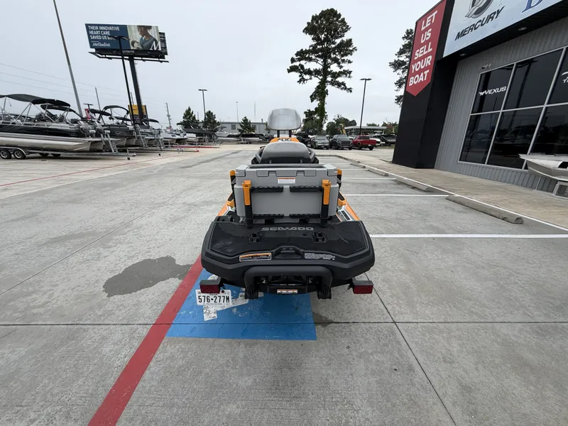 Slide: The Image of A 2022 Sea-Doo FISH PRO TROPHY 170 is parked in front of a boat dealership. - 9