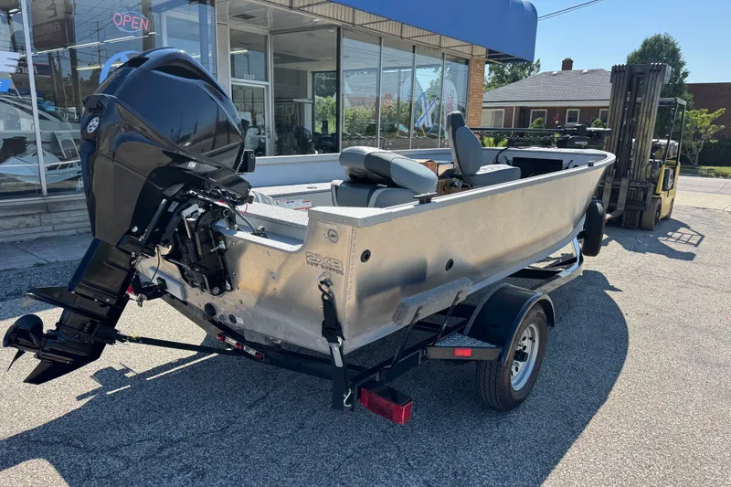 Slide: The Image of 2020 Alumacraft Summit 165 boat on trailer outside dealership. - 5