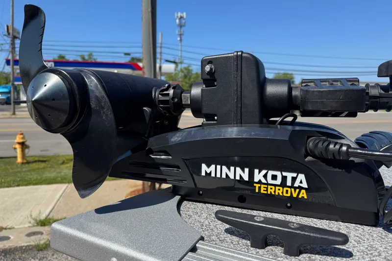 Slide: The Image of Minn Kota Terrova motor on 2020 Alumacraft Summit 165 boat, parked outdoors. - 9
