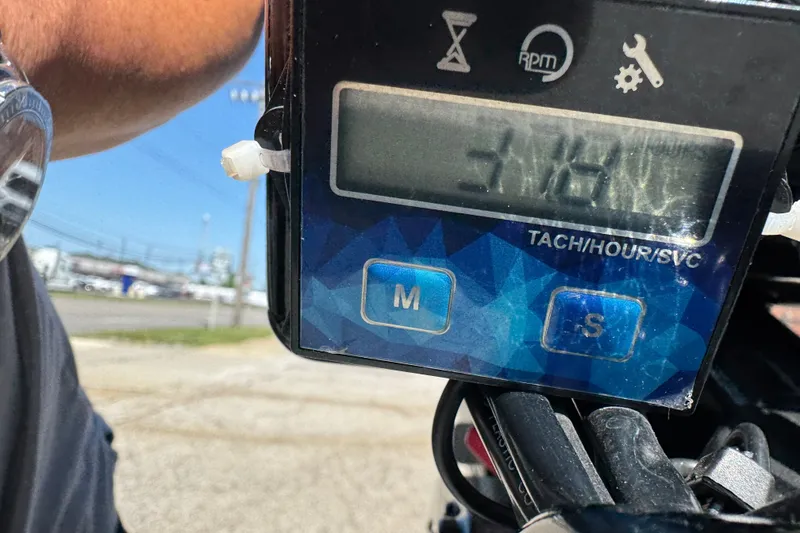 Slide: The Image of Digital tachometer display on a 2020 Alumacraft Summit 165 boat. - 4