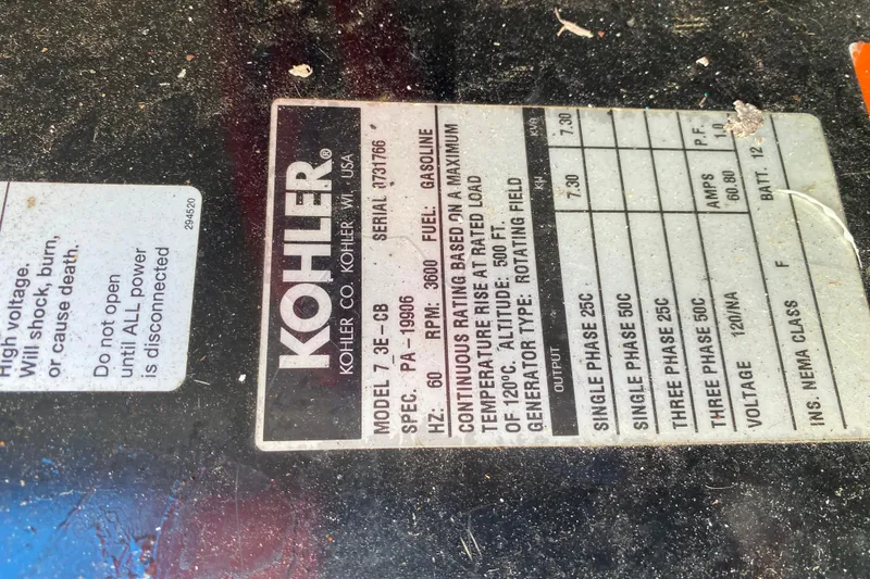 Slide: The Image of Kohler generator label on 2003 Carver 350 Mariner, detailing specifications and safety warnings. - 43