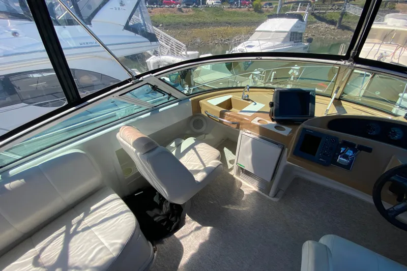 Slide: The Image of Interior view of 2003 Carver 350 Mariner yacht cockpit with seating and navigation equipment. - 28