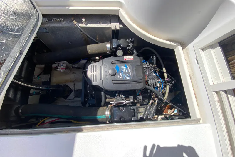 Slide: The Image of Engine compartment of a 2003 Carver 350 Mariner boat, featuring a MerCruiser 6.2 MPI engine. - 47