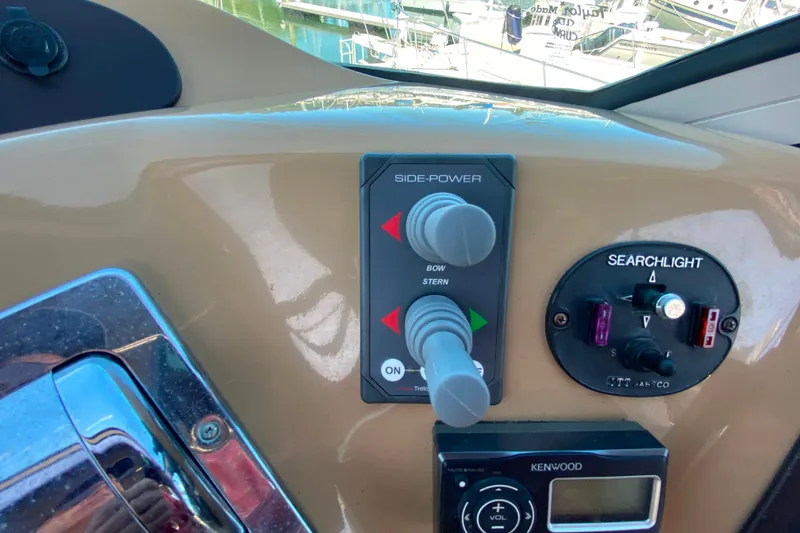 Slide: The Image of Control panel of a 2003 Carver 350 Mariner boat with side-power and searchlight controls. - 31