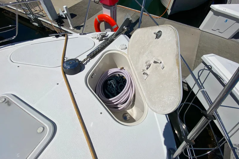 Slide: The Image of Deck view of a 2003 Carver 350 Mariner with open storage compartment. - 49