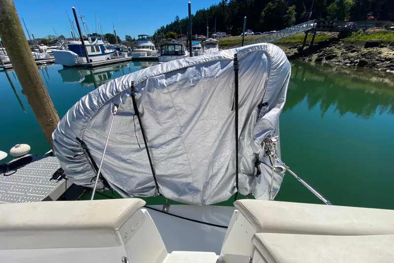 Slide: The Image of 2003 Carver 350 Mariner with covered equipment at marina dock. - 35
