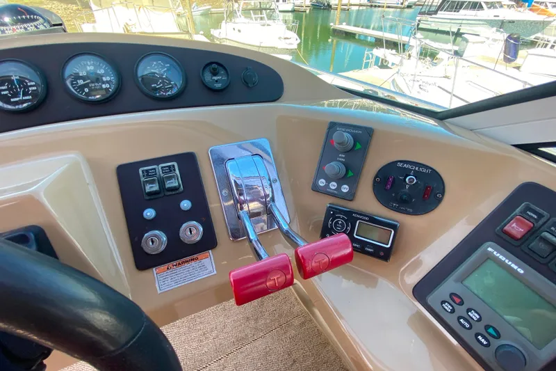 Slide: The Image of Control panel of a 2003 Carver 350 Mariner boat with gauges and switches. - 33
