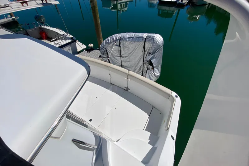 Slide: The Image of 2003 Carver 350 Mariner yacht deck with covered equipment, docked in marina. - 51