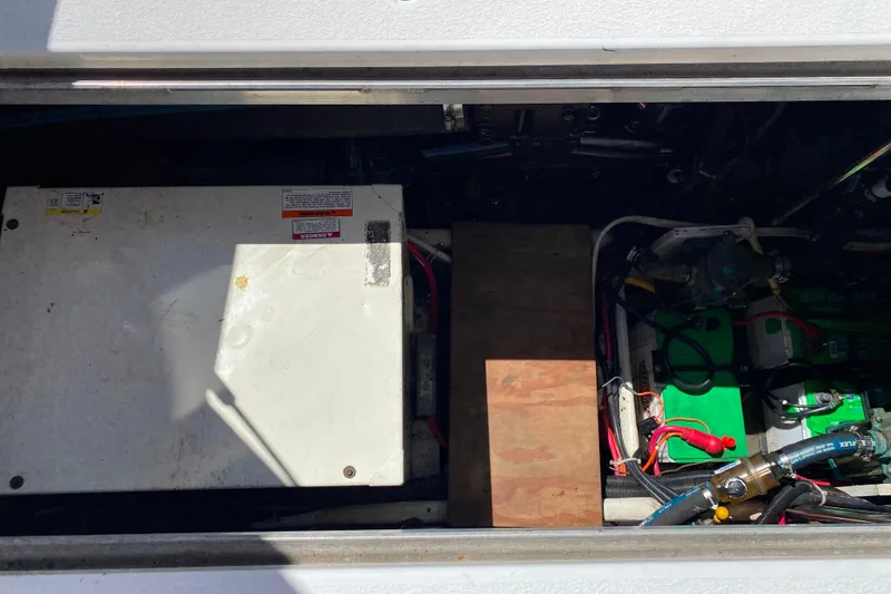 Slide: The Image of Engine compartment of a 2003 Carver 350 Mariner, showcasing electrical components and wiring. - 40