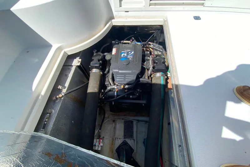Slide: The Image of Engine compartment of a 2003 Carver 350 Mariner boat, showcasing the engine and components. - 46