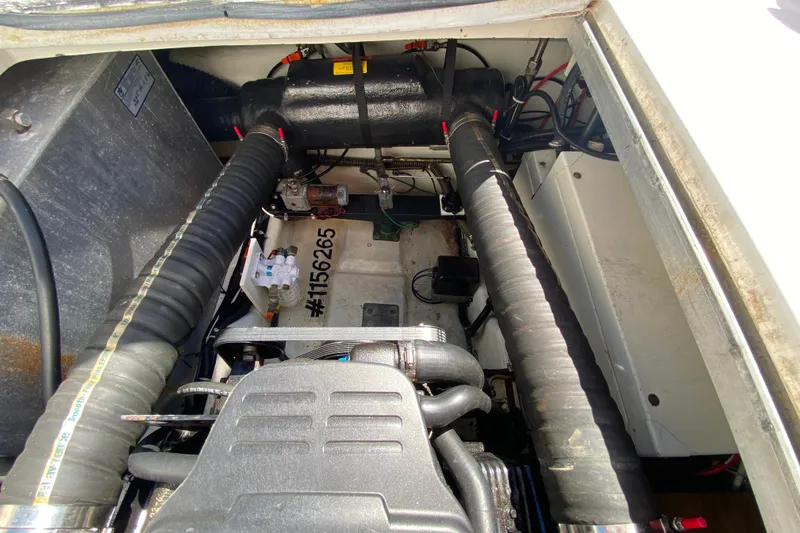 Slide: The Image of Engine compartment of a 2003 Carver 350 Mariner boat, showing detailed components. - 39
