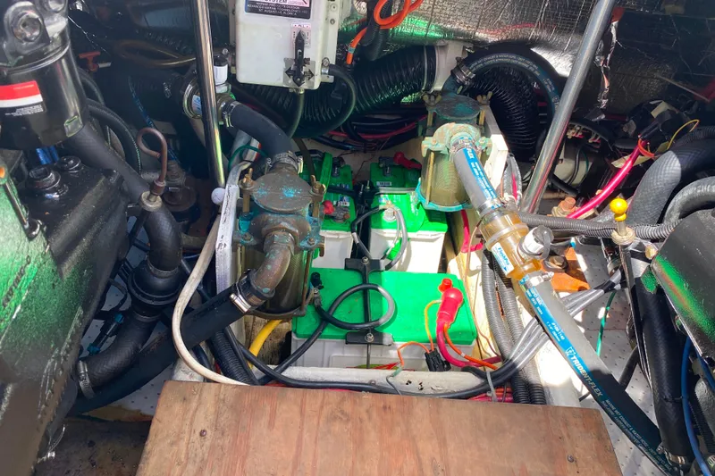 Slide: The Image of Engine room of a 2003 Carver 350 Mariner with visible mechanical components and wiring. - 42