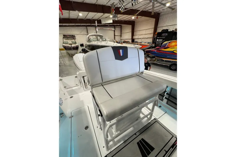Slide: The Image of 2026 Wellcraft 243 Fisherman boat interior with seating in a showroom. - 8