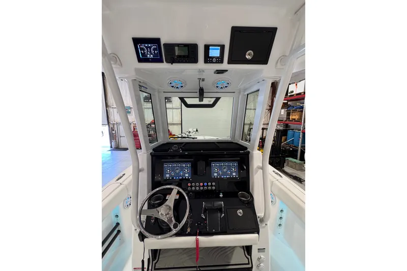 Slide: The Image of 2026 Wellcraft 243 Fisherman boat dashboard with advanced navigation and control systems. - 7