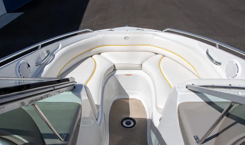 Slide: The Image of The image shows the bow area of a 2008 Crownline 210 LS boat with white upholstery. - 10