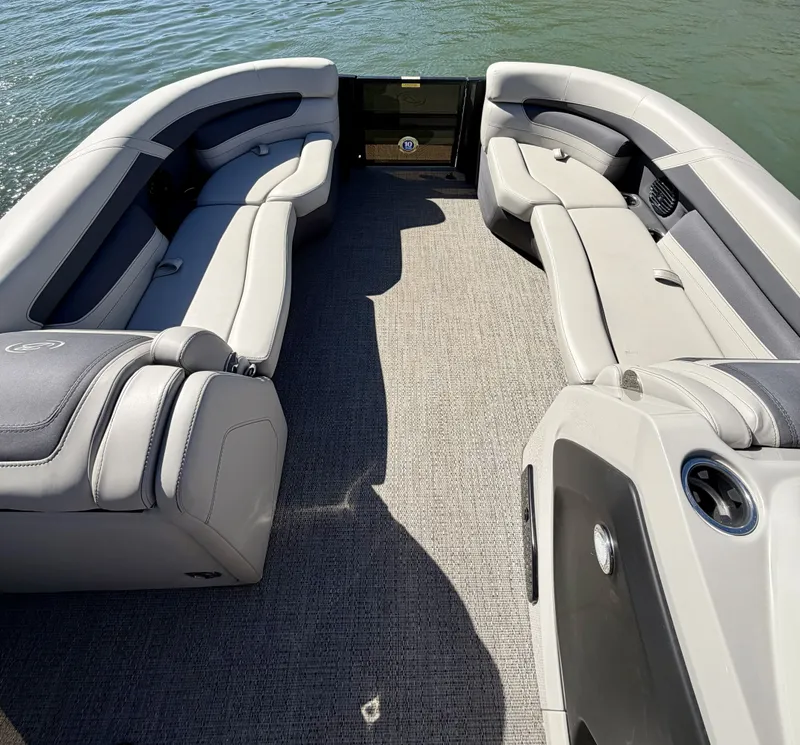 Slide: The Image of The image shows the interior of a 2024 Barletta Cabrio 24 UE with gray upholstered seating. - 5