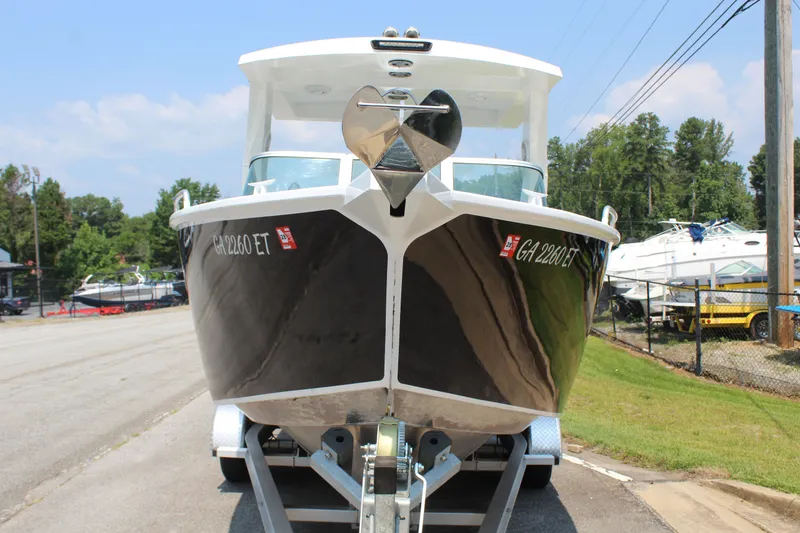 Slide: The Image of A 2024 Alaska Sea King Pro Fisher 23 on a trailer, ready for the water. - 4