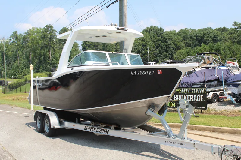 Slide: The Image of A 2024 Alaska Sea King Pro Fisher 23 on a trailer, ready for the water. - 7