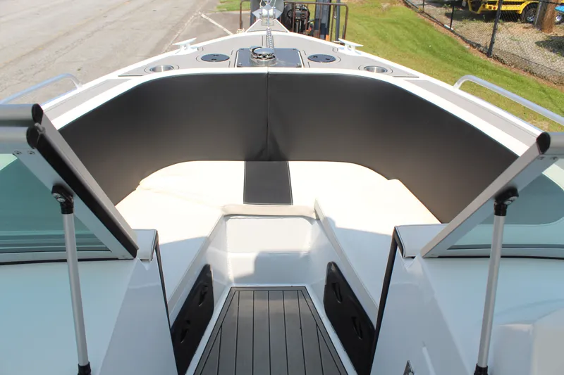Slide: The Image of The image shows the bow area of a 2024 Alaska Sea King Pro Fisher 23 boat. - 13