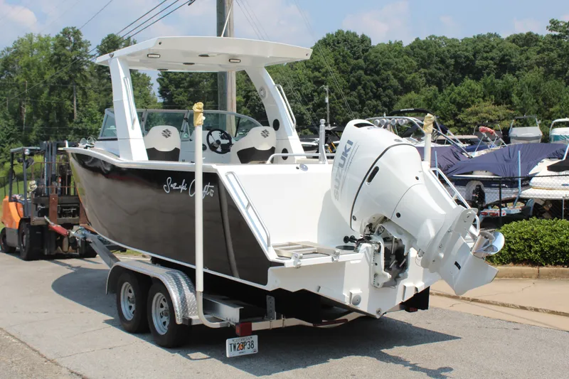 Slide: The Image of The image shows a 2024 Alaska Sea King Pro Fisher 23 boat on a trailer. - 3