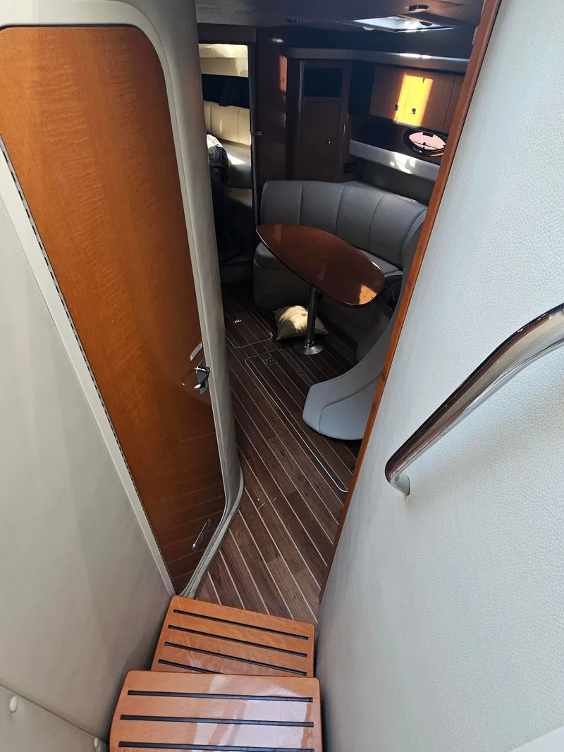 Slide: The Image of Interior of the 2011 Chaparral 370 Signature with wood flooring and a stylish seating area. - 3