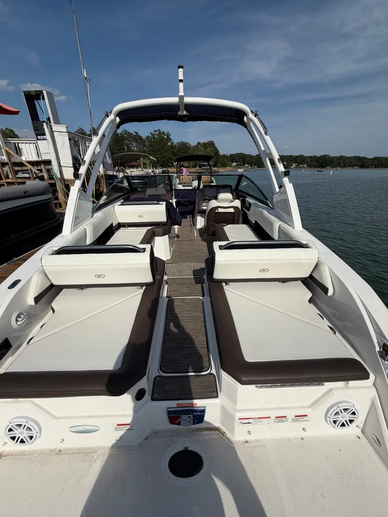 Slide: The Image of The image shows a 2022 Cobalt R6 Outboard boat with luxurious seating and an open deck. - 5