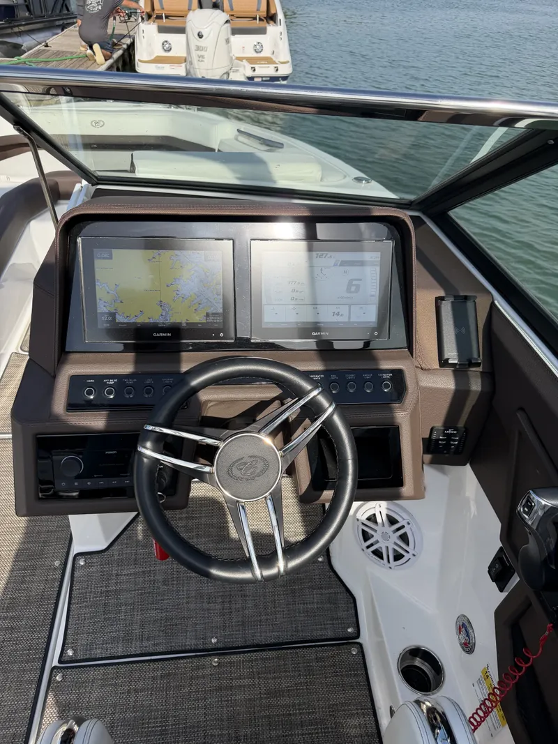 Slide: The Image of The image shows the cockpit of a 2022 Cobalt R6 Outboard with two large screens and a sleek steering wheel. - 3
