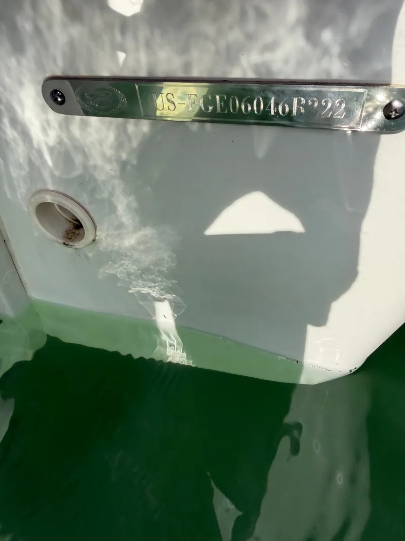 Slide: The Image of Close-up of a 2022 Cobalt R6 Outboard hull in the water. - 8