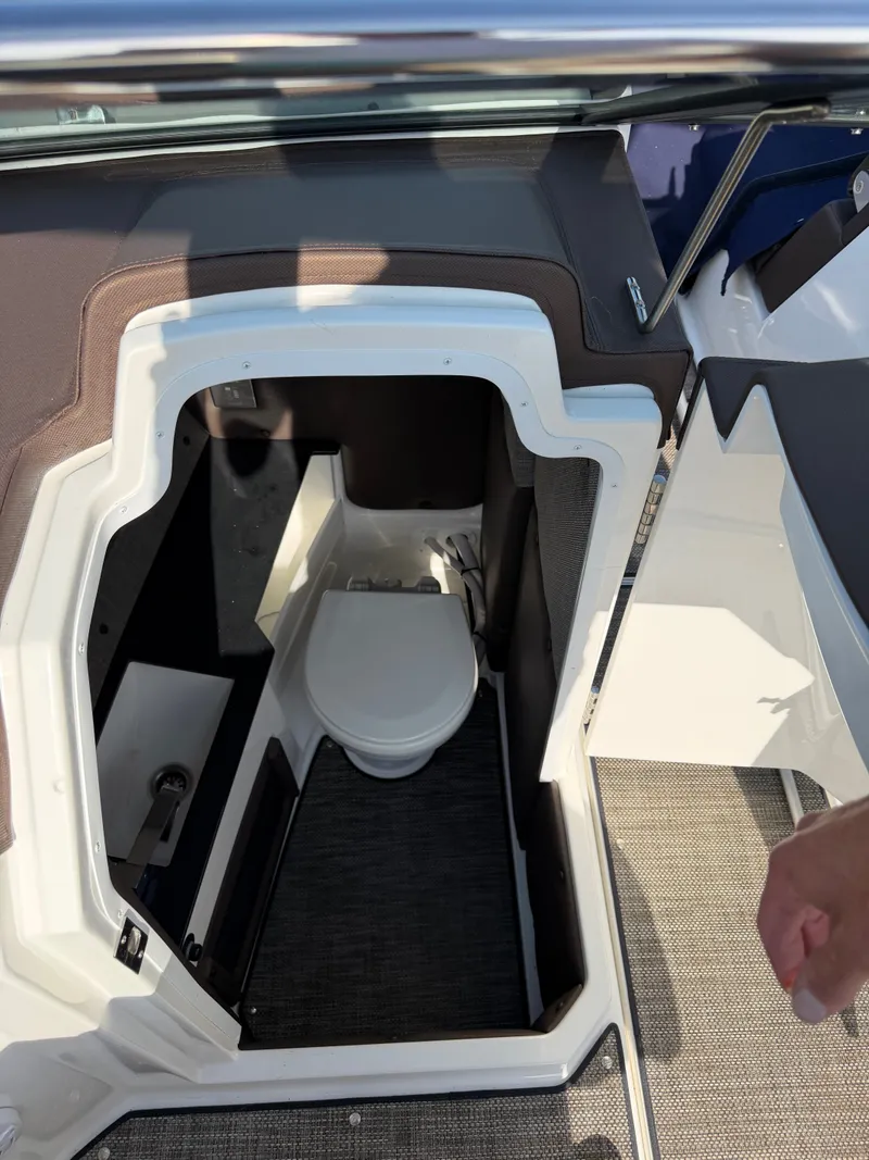 Slide: The Image of The image shows the interior of a 2022 Cobalt R6 Outboard featuring a toilet. - 6