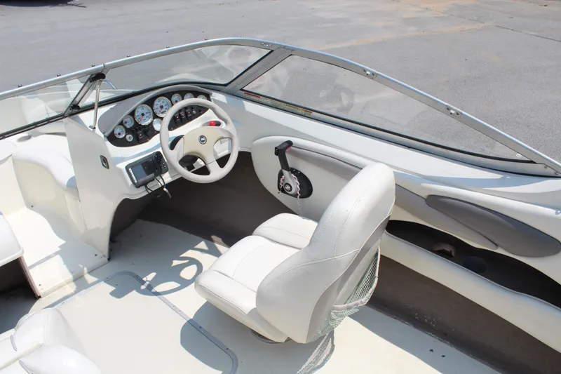 Slide: The Image of The image shows the cockpit of a 2012 Stingray 185 LS with a white steering wheel and dashboard. - 10