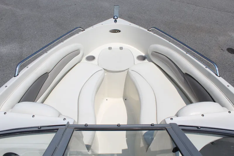 Slide: The Image of The image shows the bow of a 2012 Stingray 185 LS boat with white cushioned seating. - 13