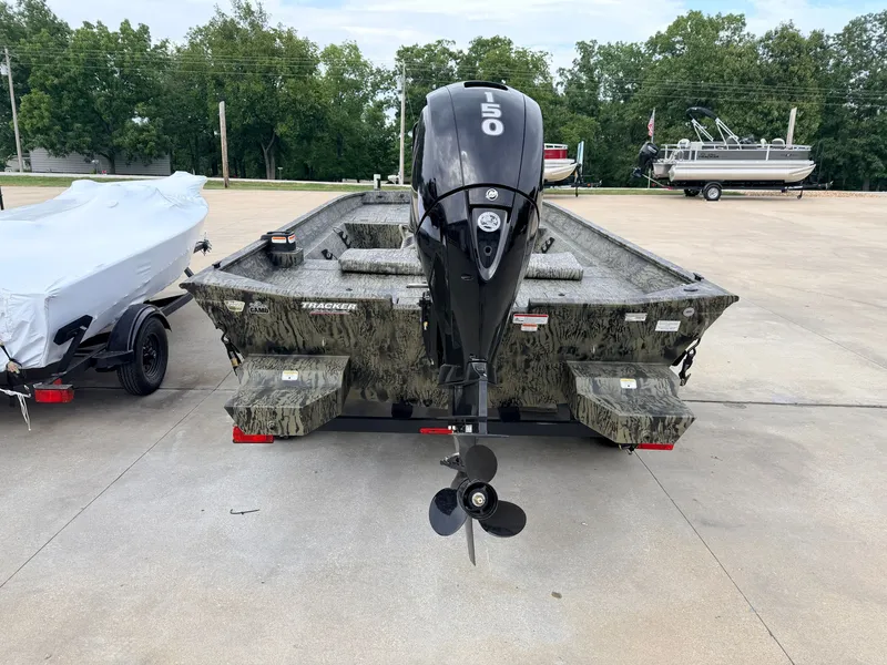 Slide: The Image of The image shows a 2027 Tracker Grizzly 2072 CC boat with a 50 HP motor. - 3