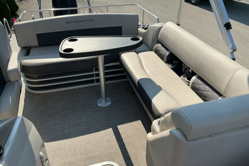 Slide: The Image of 2019 Bennington 22 SSLX pontoon boat interior with seating and table. - 7