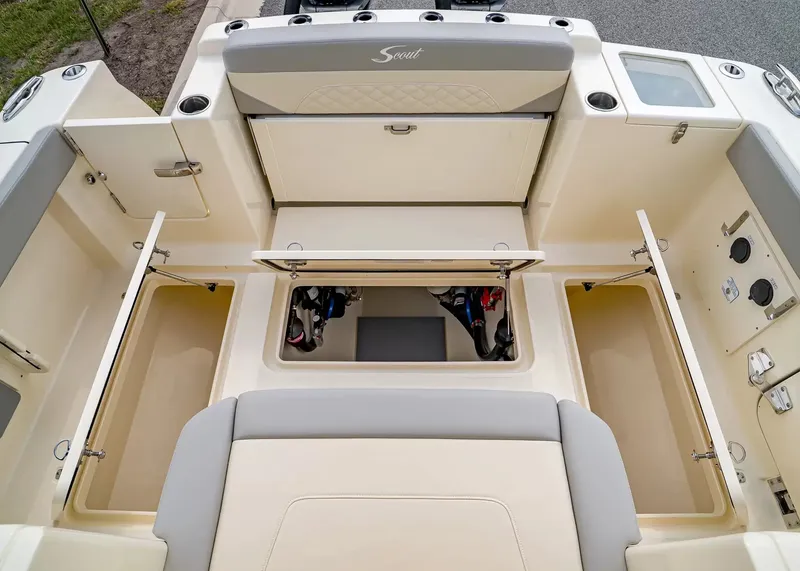 Slide: The Image of The image shows the cockpit of a Scout 330 LXF boat with multiple storage compartments. - 10