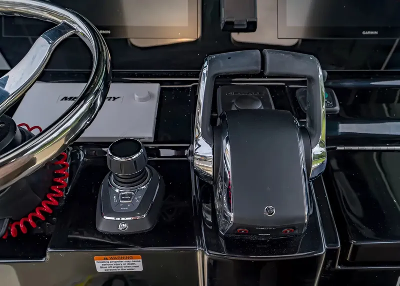 Slide: The Image of The image shows the helm of a Scout 330 LXF boat with modern controls. - 22