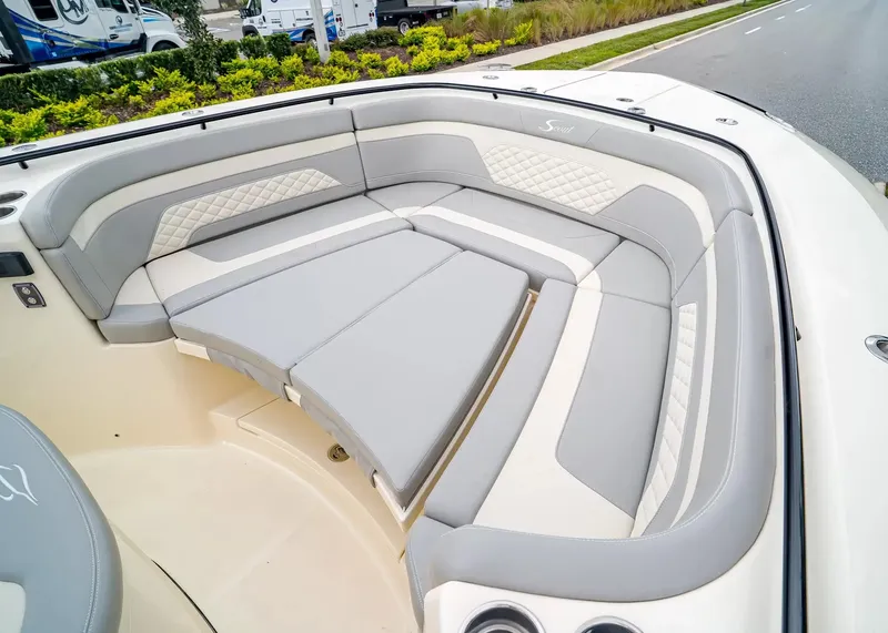 Slide: The Image of The 2027 Scout 330 LXF features a luxurious, cushioned seating area in the bow. - 36
