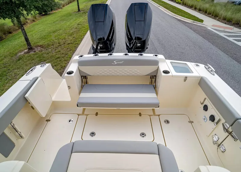 Slide: The Image of The image shows the cockpit of a Scout 330 LXF boat with two outboard engines. - 8