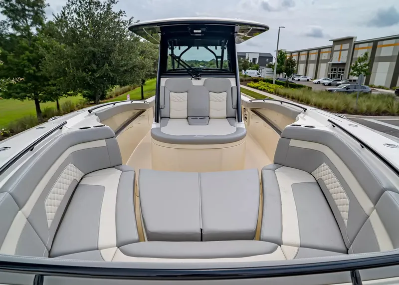 Slide: The Image of The image shows the spacious bow area of a Scout 330 LXF boat with elegant seating. - 32