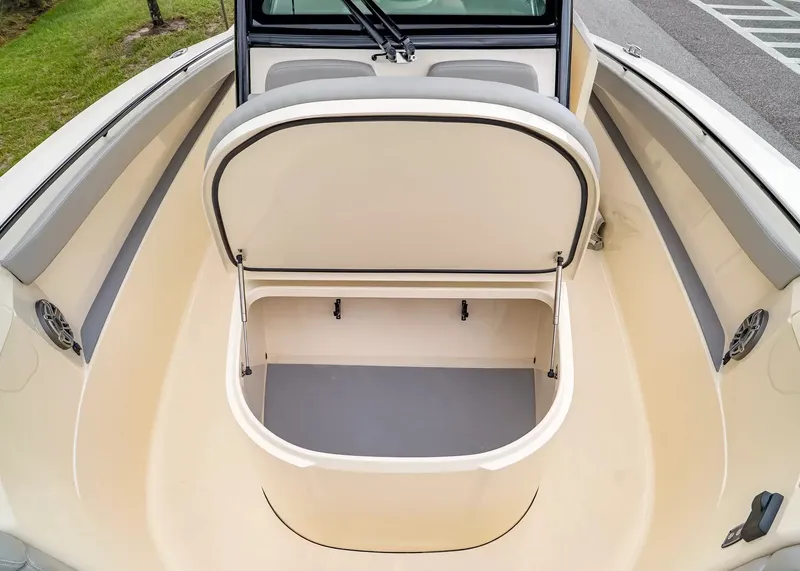 Slide: The Image of The 2027 Scout 330 LXF features an open storage compartment in the bow area with cushioned seating. - 33