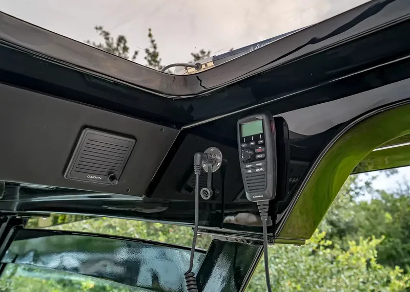 Slide: The Image of The image shows the dashboard of a Scout 330 LXF with a radio and speaker. - 23