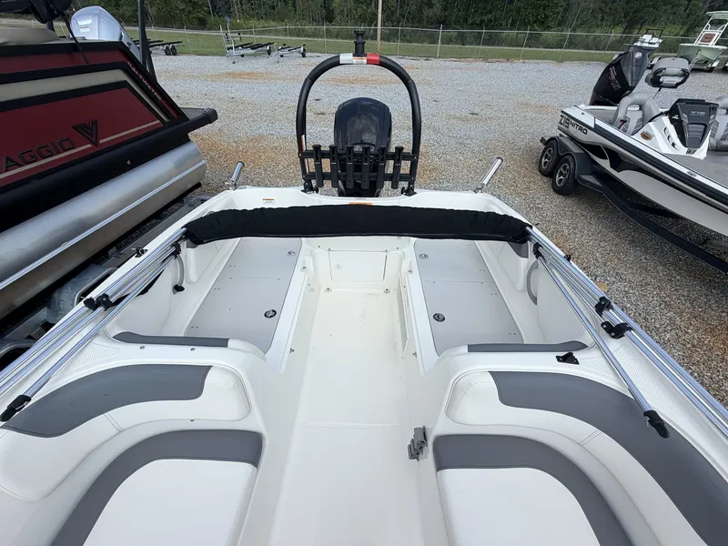 Slide: The Image of The image shows the cockpit of a 2018 Bayliner 180 Element XL with gray and white seating. - 12