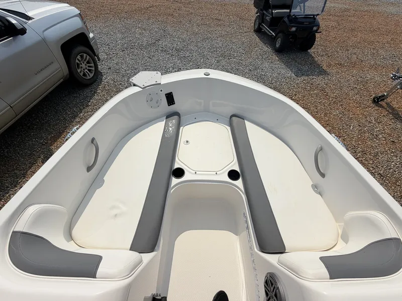 Slide: The Image of The image shows the cockpit of a 2018 Bayliner 180 Element XL with gray and white seating. - 7