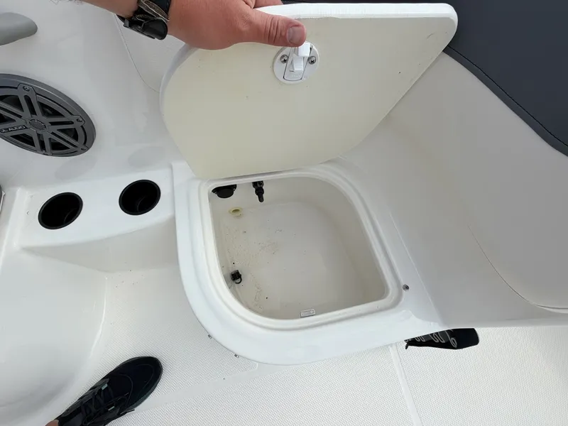 Slide: The Image of An open storage compartment on a 2018 Bayliner 180 Element XL boat. - 10