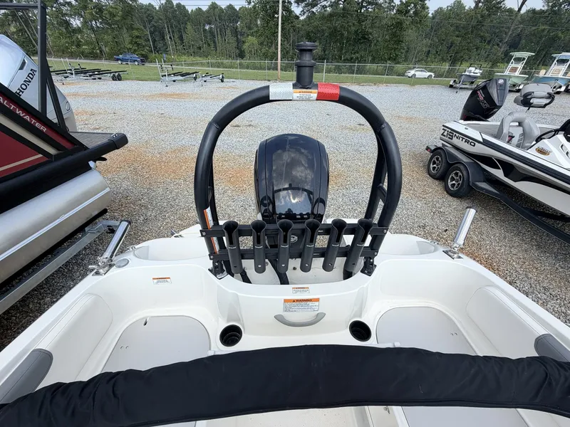 Slide: The Image of The image shows the cockpit of a 2018 Bayliner 180 Element XL with an outboard motor. - 3
