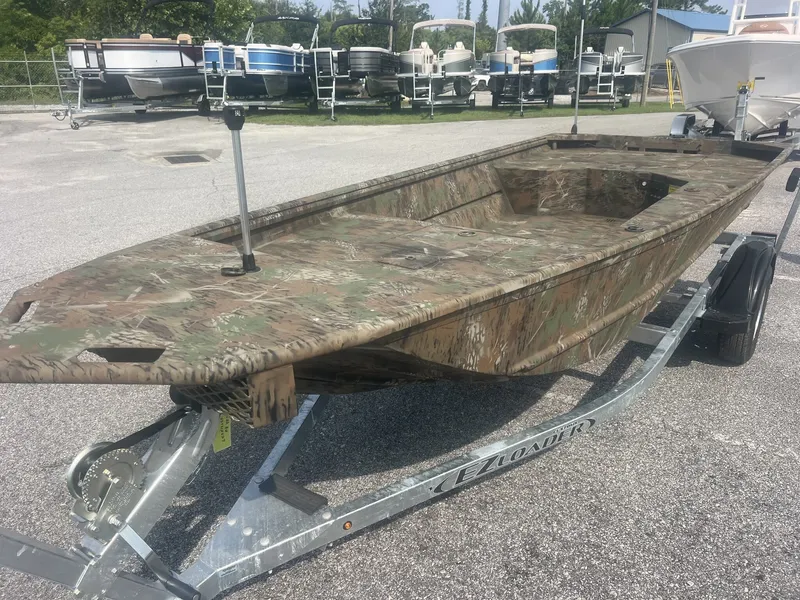 The Image of A G3 Gator Tough 15DK-40HP YAMAHA boat on a trailer, painted in camouflage pattern. - 1